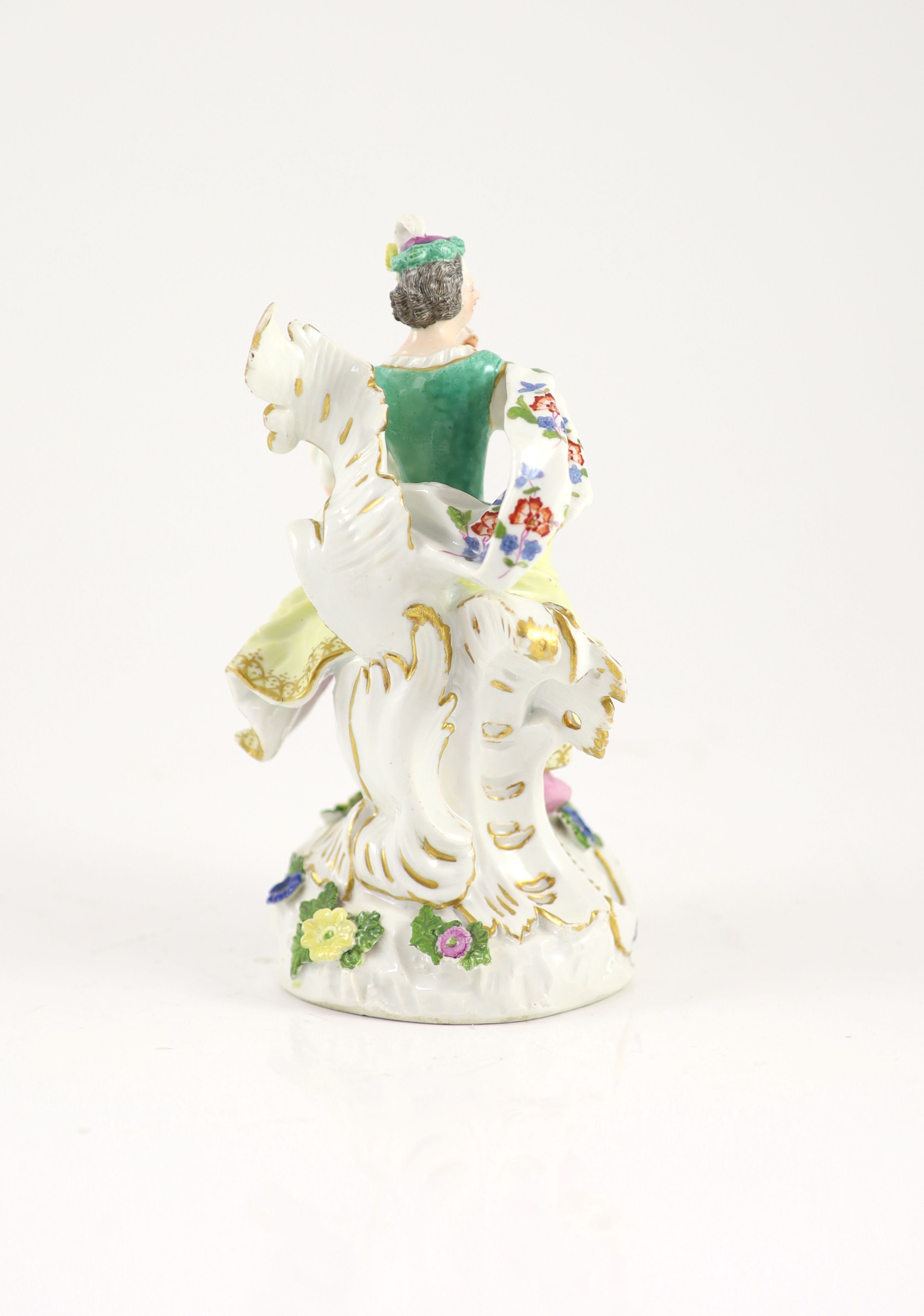 A Meissen rococo group of a seated lady and a dog c.1760, 18 cm high, some restorations